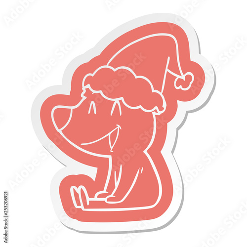 sitting bear cartoon sticker of a wearing santa hat