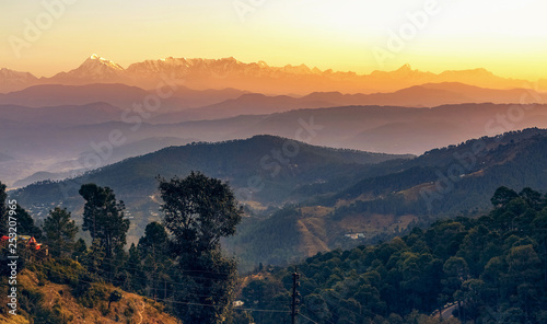 Sunrise at Kausani Uttarakhand India with scenic view of adjacent mountain ranges with Himalaya snow peaks. © Roop Dey