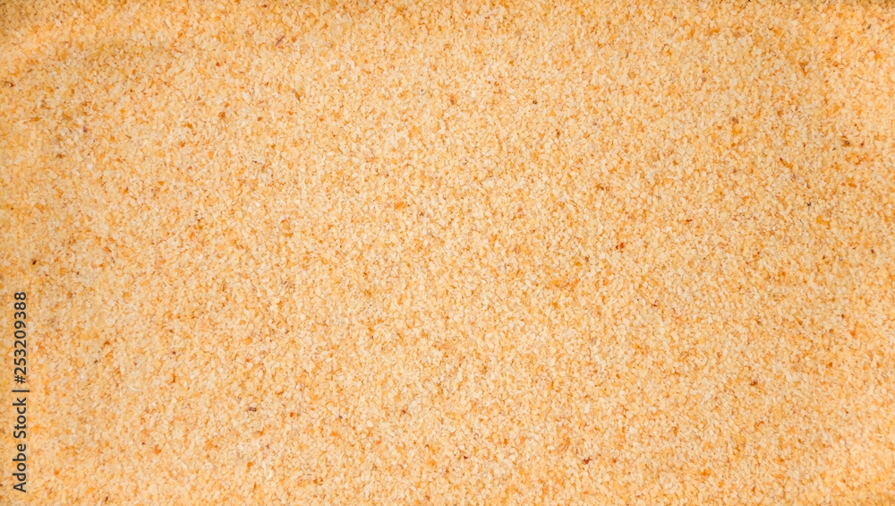 dried milled ground garlic background. Natural seasoning texture. Natural spices and food ingredients.