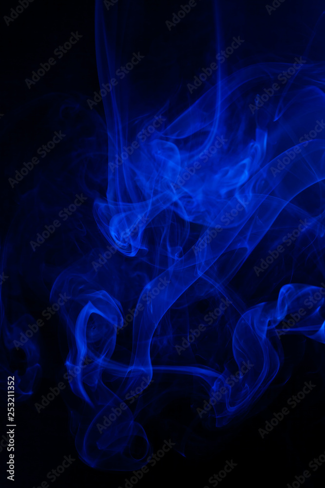 Blue smoke on black background.