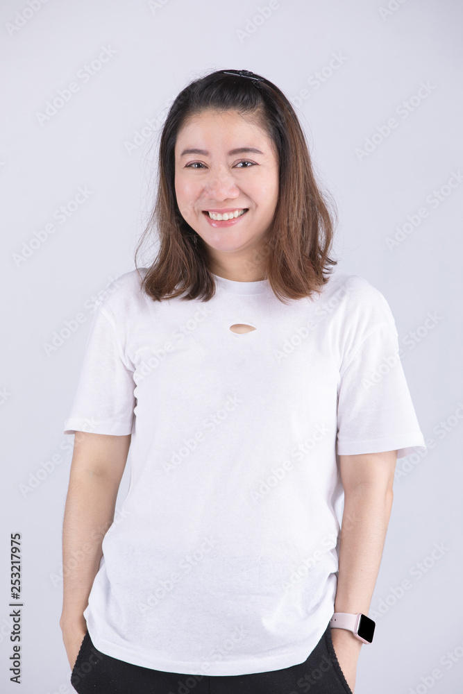 Cute woman model in studio over gray background. Cute woman model in studio over gray background.