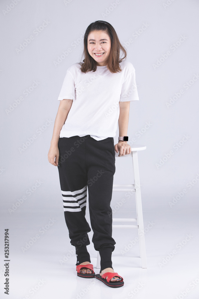 Cute woman model in studio over gray background. Cute woman model in studio over gray background.