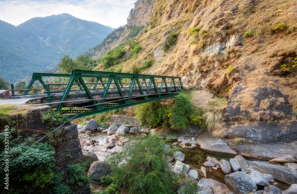 Mountain bridge with scenic landscape near Birthi waterfall at Munsiyari Uttarakhand India.
