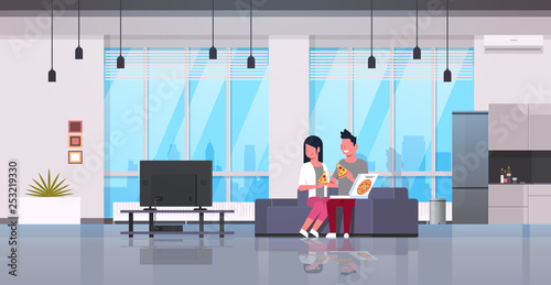happy couple eating pizza man woman watching tv on couch modern apartment home interior male female cartoon characters flat horizontal