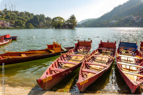 Wooden tourist boats at scenic Bhimtal lake at Nainital Uttarakhand India.