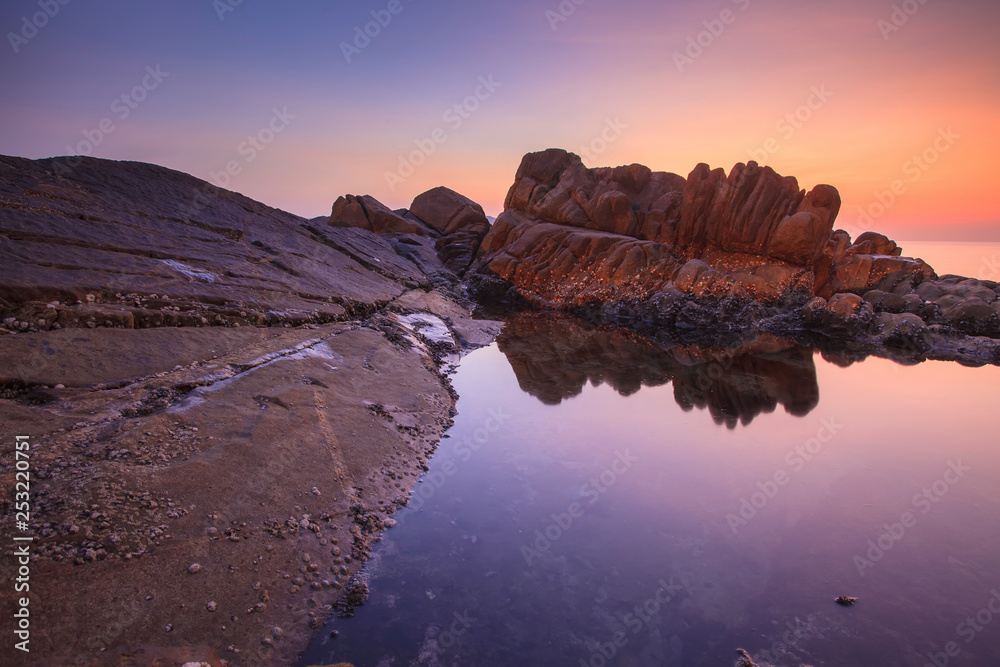 red rock beach sunset