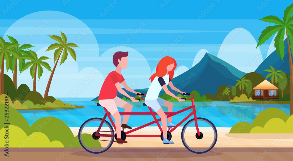 Fototapeta premium couple in love riding tandem bicycle summer vacation sea beach landscape beautiful seaside man woman lovers cycling twin bike horizontal flat