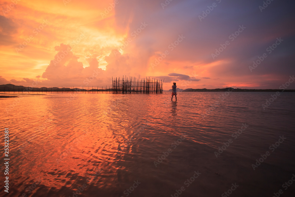 the man at sunset over lake