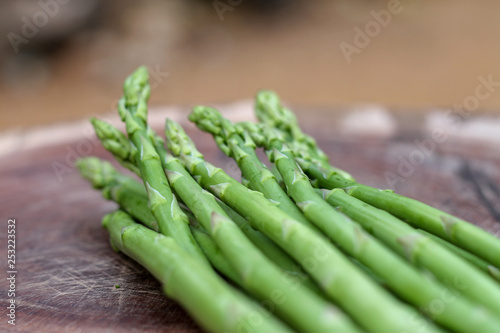Raw asparagus. Fresh Asparagus on wooden background