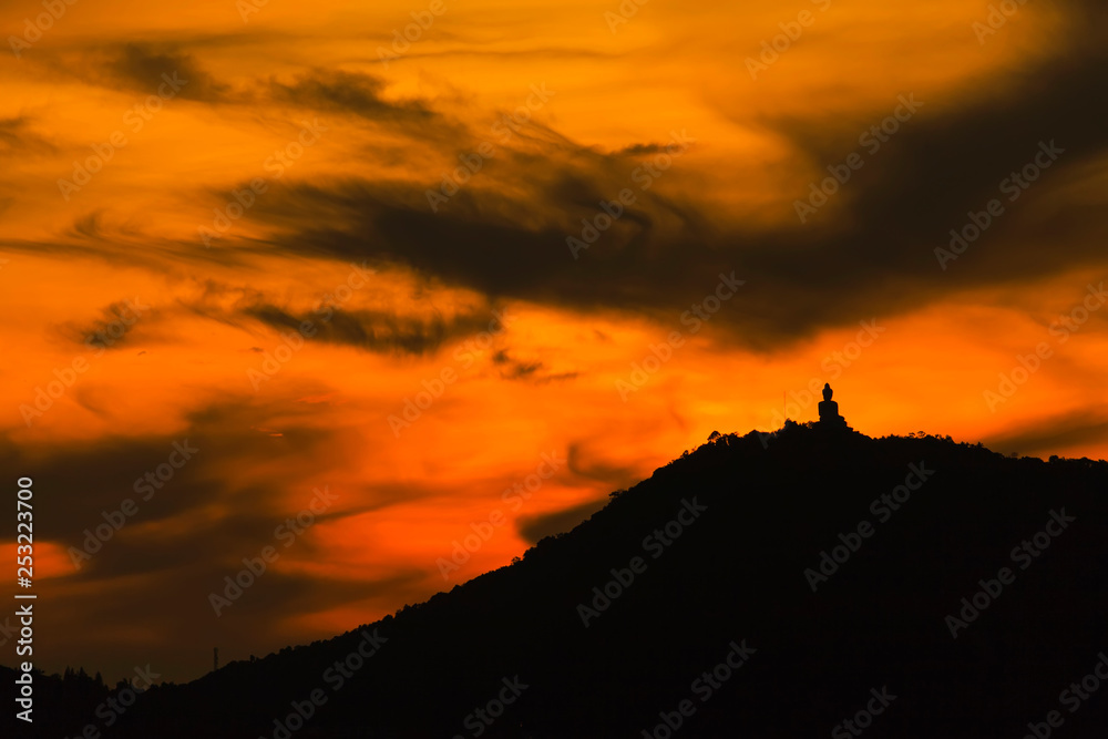 silhouette of big buddha at sunset