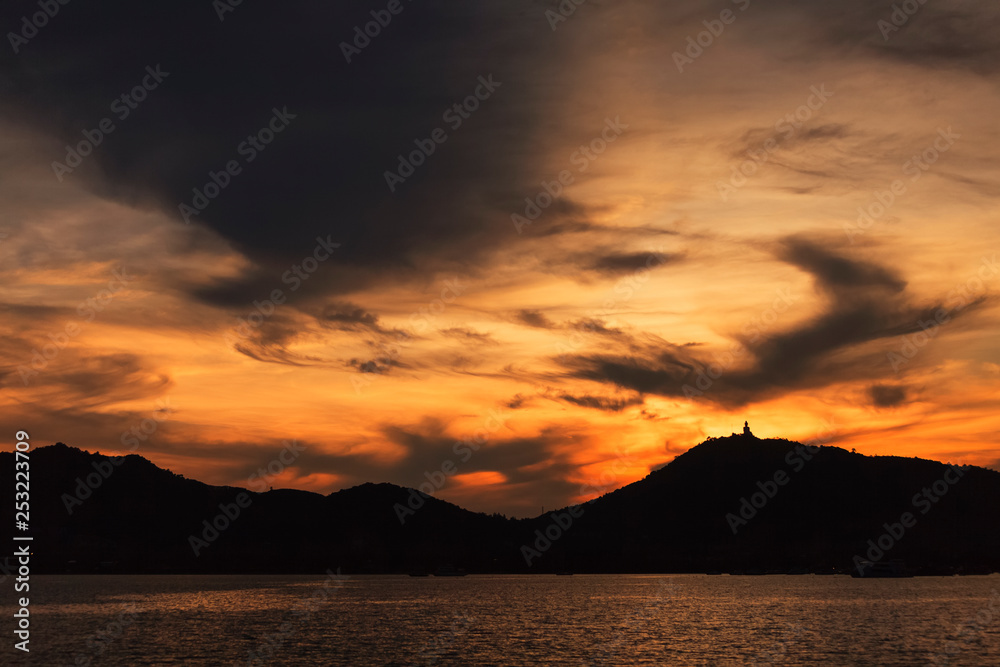 silhouette of big buddha at sunset