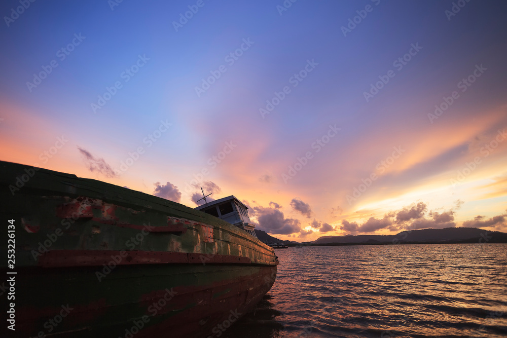 old fishing boat at sunset