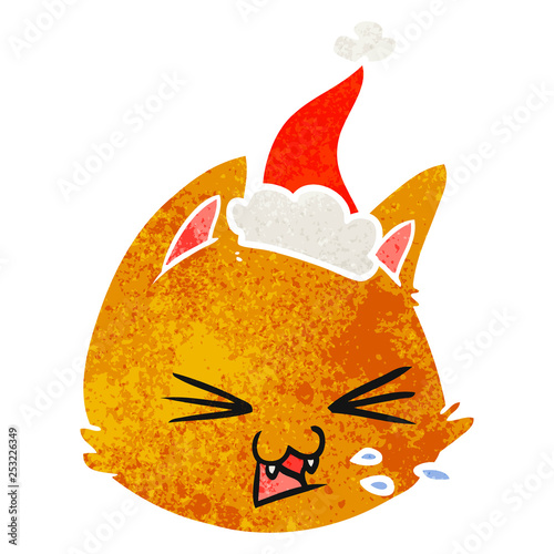 spitting retro cartoon of a cat face wearing santa hat