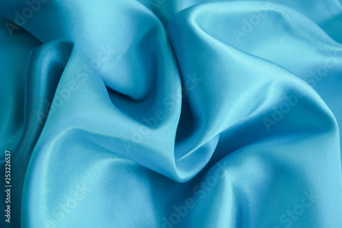 Fabric blue waves - material for background and texture.