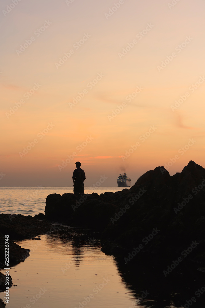 fishing at sunset