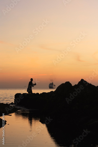 fishing at sunset