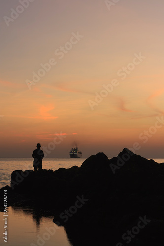 fishing at sunset