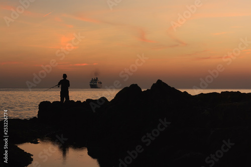 fishing at sunset