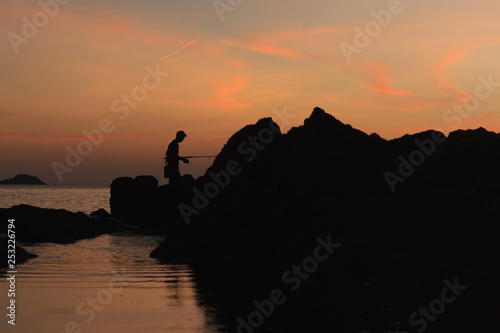 fishing at sunset