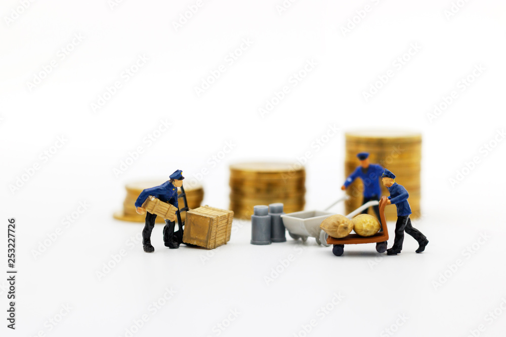 Obraz premium Miniature people: Workers transport coins money. Success, Finance, investment and growth in business concept.