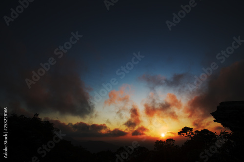 Stone profile and trees silhouettes at sunrise in Brazil