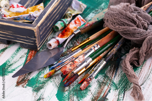 Paint brushes and paints for drawing.