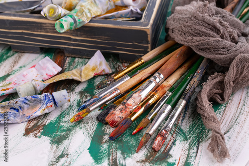 Paint brushes and paints for drawing.