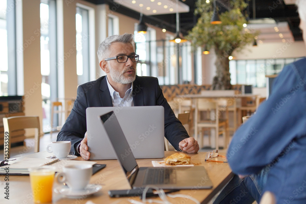 Work colleagues discussing ideas in informal business meeting