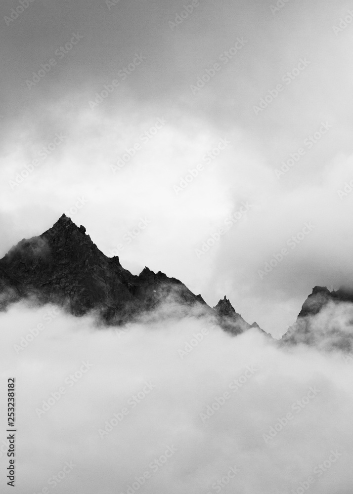 Kinner Kailash mountain range peeking through the heavy clouds