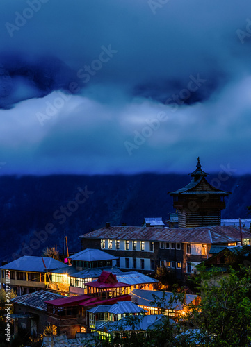 Blue magic hour at the beautiful town of Kalpa which is covered under heavy clouds photo