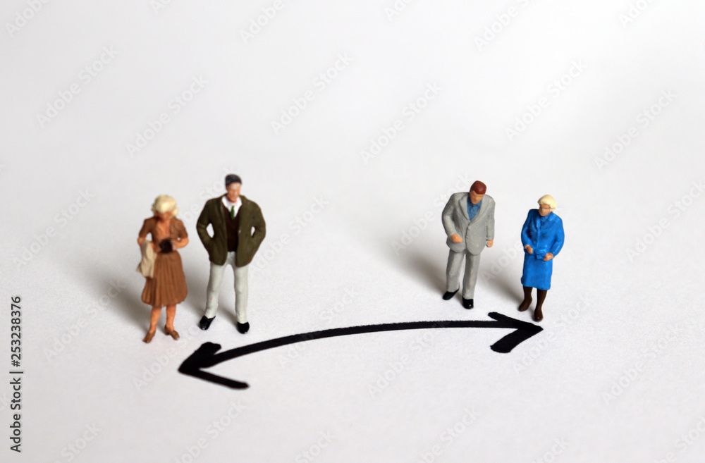 Miniature people who stand in a different direction. Miniature people who stand in a different direction.