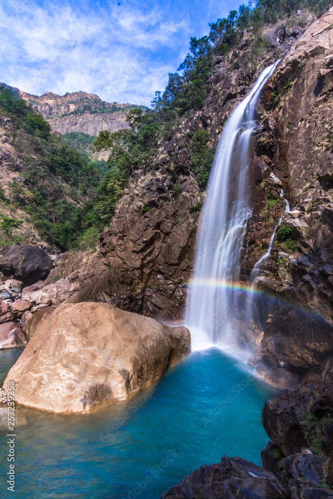 Naklejka premium The rainbow waterfall of Nongriat in Meghalaya with that clear blue water is a wonderful pool to swim.