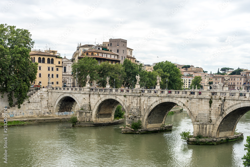 Italy, Rome, Tiber, a large bridge over some water with Tiber in the background