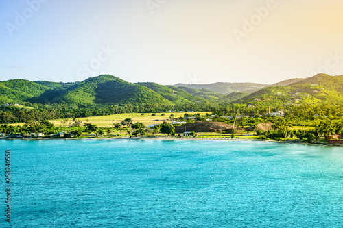 Mountain landscape with small beach at the coastline of Frederiksted, St Croix, US Virgin Islands.  photo