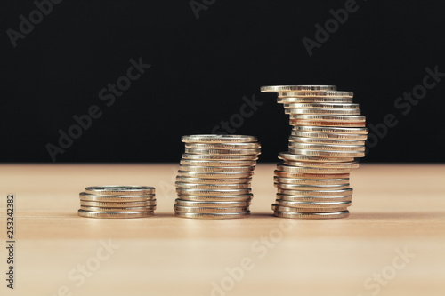 piles of coins on working table