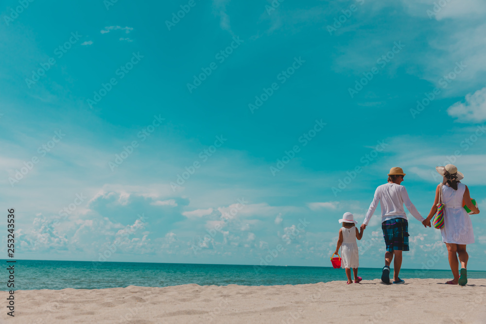 happy family with child walking on tropical beach happy family with child walking on tropical beach