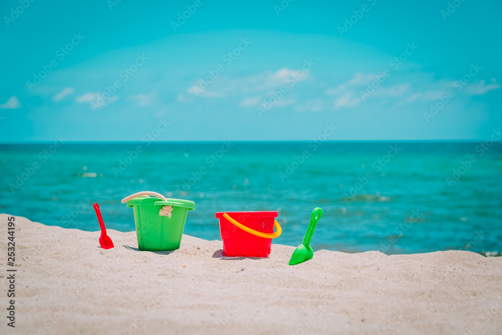 kids toys on tropical sand beach, family vacation kids toys on tropical sand beach, family vacation