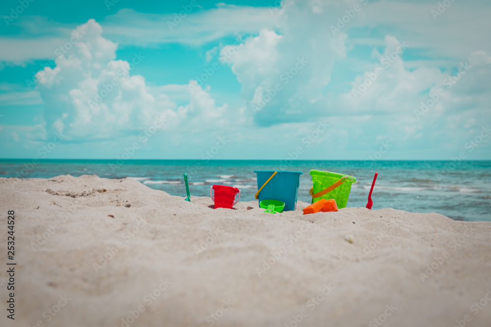 kids toys on tropical sand beach, family vacation kids toys on tropical sand beach, family vacation
