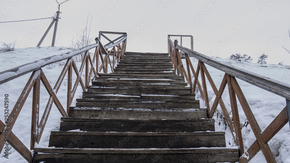 Fototapeta premium old wooden staircase leading up