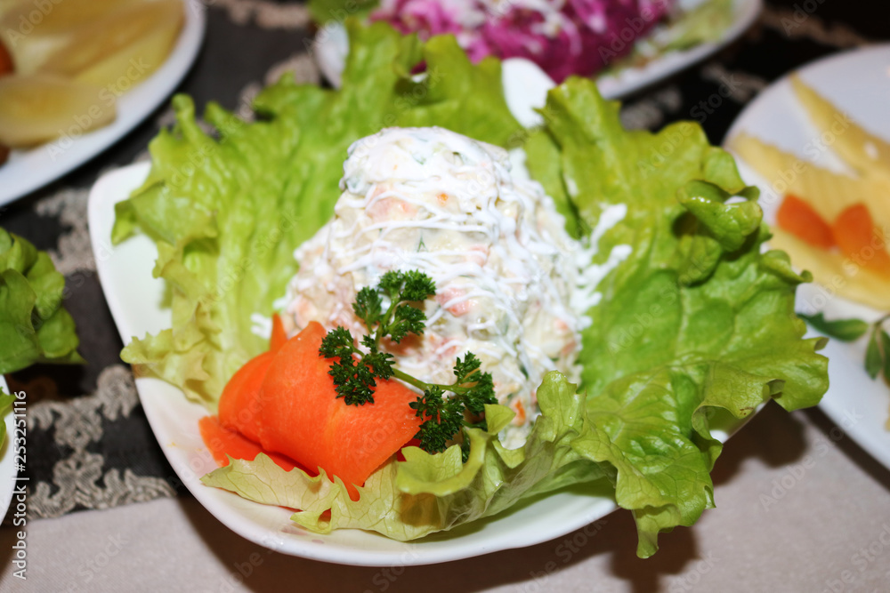 Russian salad on a festive table Russian salad on a festive table