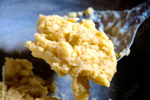 khoya is a dairy product widely used in South Asian cuisine of India. It is made of either dried whole milk or milk thickened by heating in an open iron pan. photo