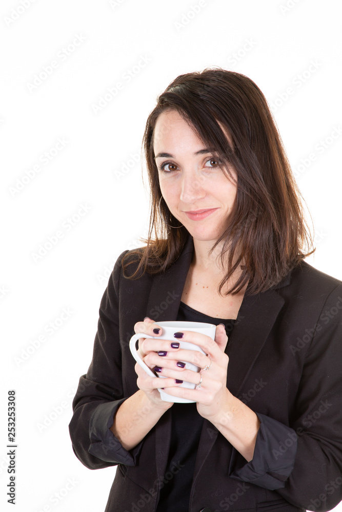 Young brunette woman drinking coffee in a mug Young brunette woman drinking coffee in a mug