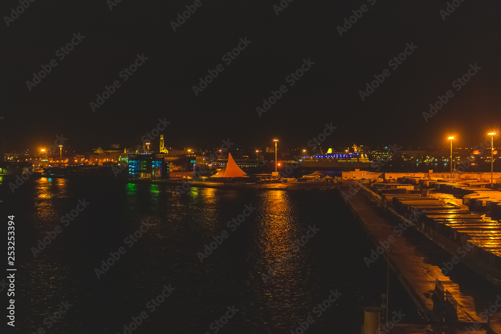 Night view of the Bari harbor with moored ferry, Italy