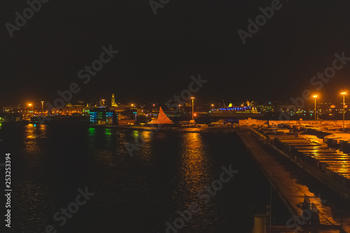 Night view of the Bari harbor with moored ferry, Italy