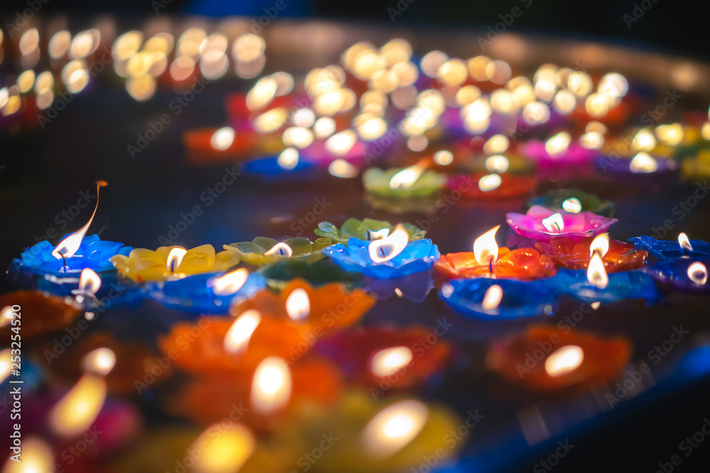 Lotus candle lit and floating on water. Lotus candle lit and floating on water.