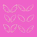 set of wings. hand-drawn vector illustration on pink background