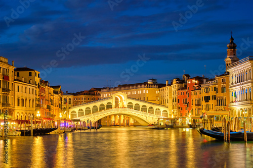  Rialto bridge Ponte di Rialto over Grand Canal at night in Venice, Italy © Dmitry Rukhlenko