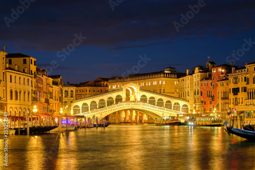  Rialto bridge Ponte di Rialto over Grand Canal at night in Venice, Italy © Dmitry Rukhlenko