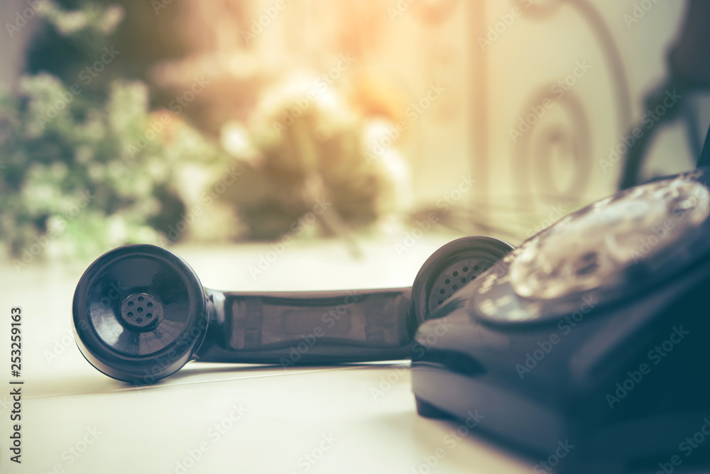Old black phone with dust and scratches, retro style concept Old black phone with dust and scratches, retro style concept