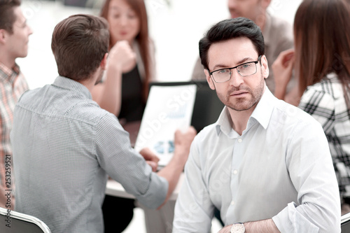 close up.successful businessman against the background of the business team